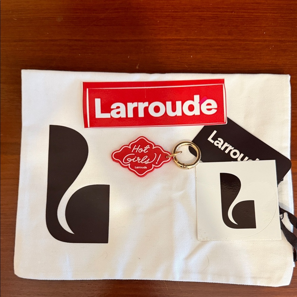 Larroude White Pouch with Black Logo and Red Keychain and stickers